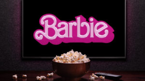 TV screen playing Barbie trailer or movie.
