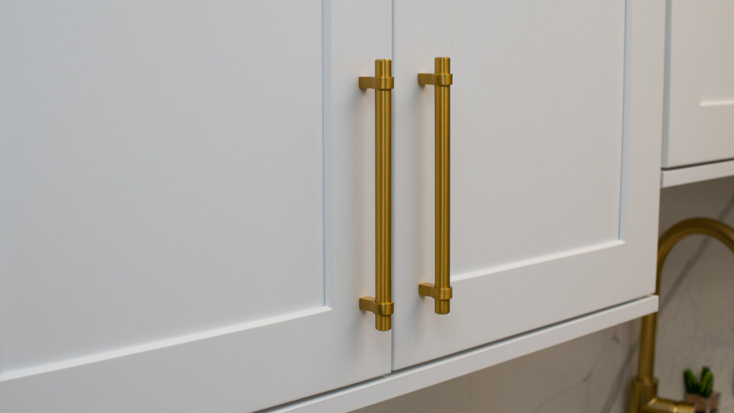 white cabinet with gold handles