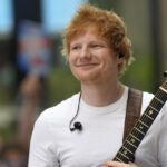 Ed Sheeran holds guitar