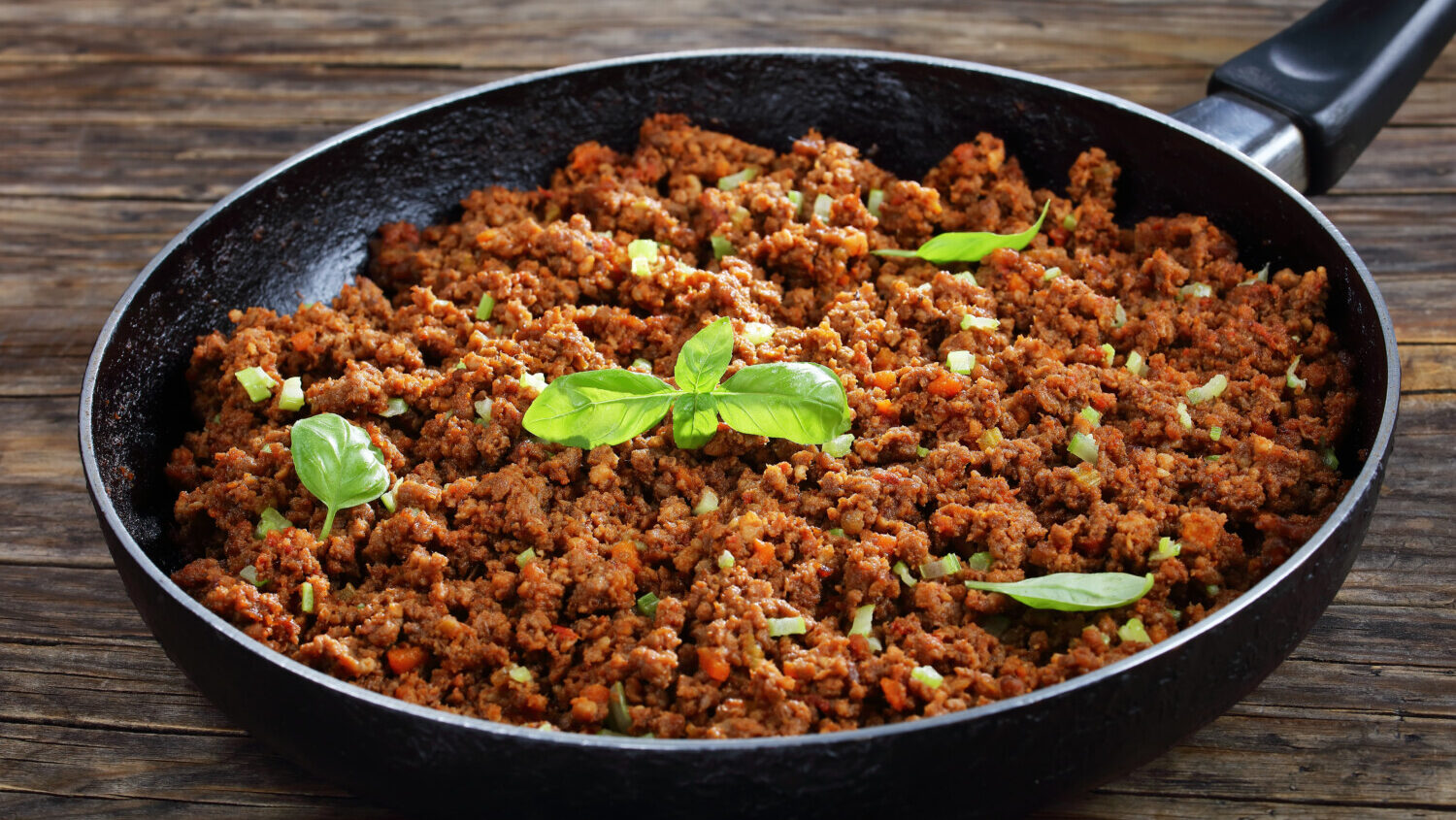 Ground beef browning in pan