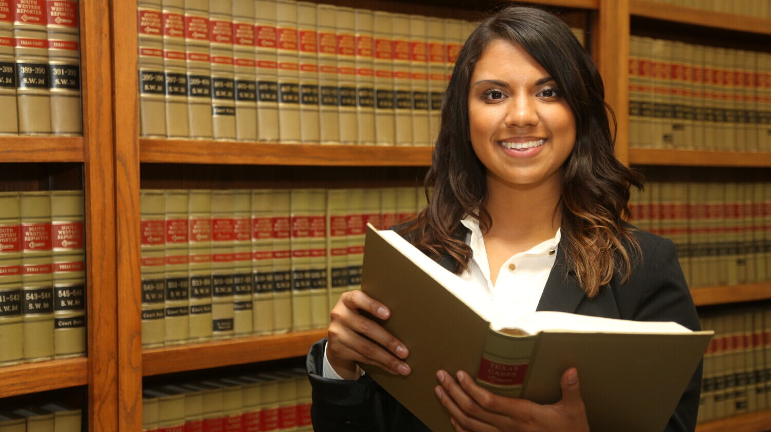 Paralegal holds law book