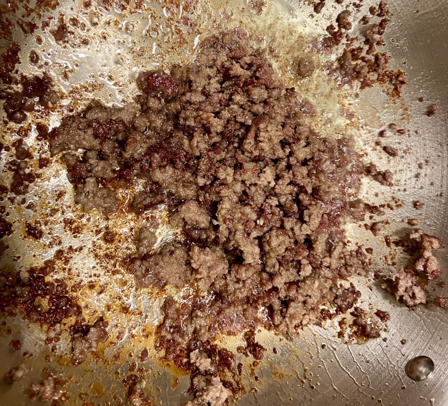 Ground beef browned in pan with baking soda