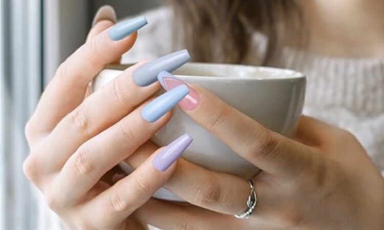 Woman's fingernails pained in paint-chip colors