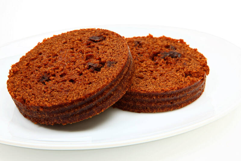 Round slices of brown bread on white plate