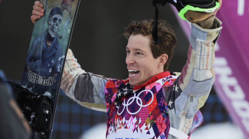 Shaun White waves to the crowd after a run during the men's snowboard halfpipe qualifying at the Winter Olympics, in Krasnaya Polyana, Russia, Feb. 11, 2014.