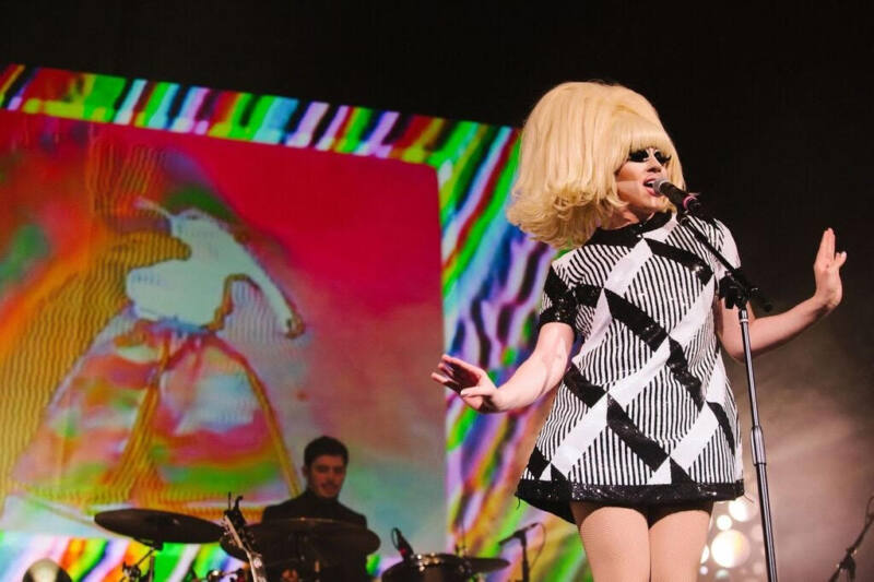 Drag Queen Trixie Mattel performs on stage in black and white dress