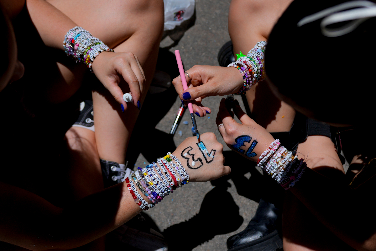 Taylor Swift fans paint numbers on their hands ahead of concert in Buenos Aires