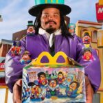Artist Kerwin Frost holds the adult Happy Meal box he designed