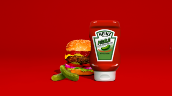 Heinz Pickle Ketchup next to cheeseburger and pickles on red background