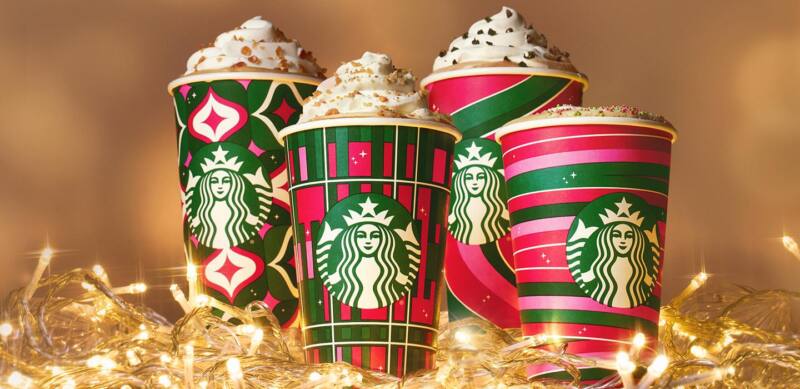 Starbucks' 2023 red and green holiday cups with drinks