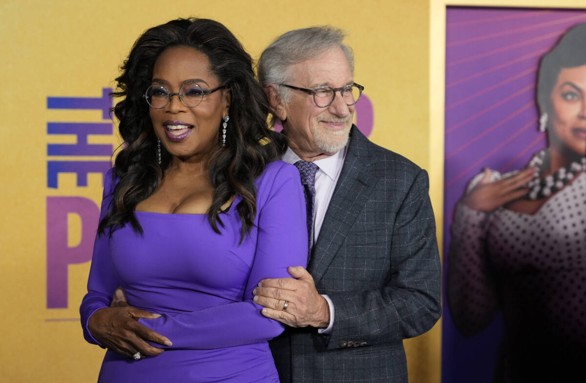 Oprah Winfrey, left, and Steven Spielberg, producers of "The Color Purple," pose together at the premiere of the film at the Academy Museum of Motion Pictures, Wednesday, Dec. 6, 2023, in Los Angeles. 