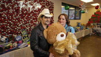 Brad Paisley, left, and Kimberly Williams-Paisley pose for a picture at The Toy Store