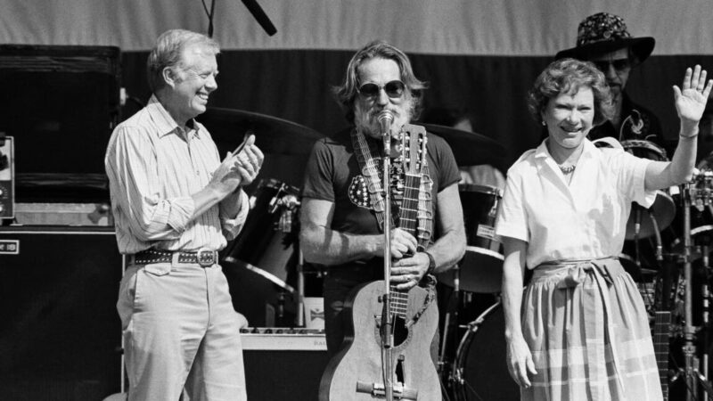 Willie Nelson on stage with former President Jimmy Carter and his wife Rosalynn Carter in 1985