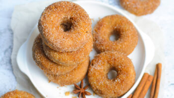 Freshly Baked Homemade Doughnuts Covered in Sugar and Cinnamon Mixture