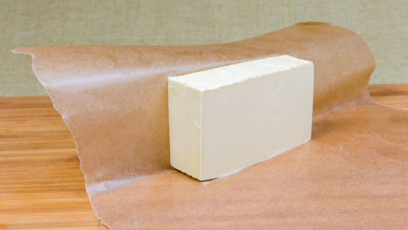 piece of butter on waxed paper