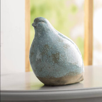 light blue ceramic bird sculpture