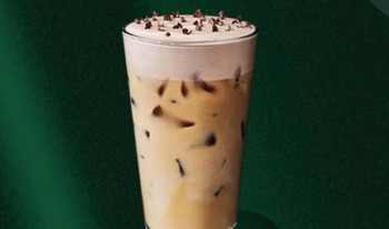 Starbucks iced merry mint mocha drink in glass cup with chocolate curls