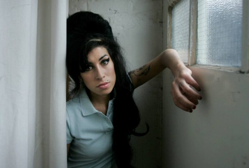 Amy Winehouse with her signature beehive hairdo and winged eyeliner 