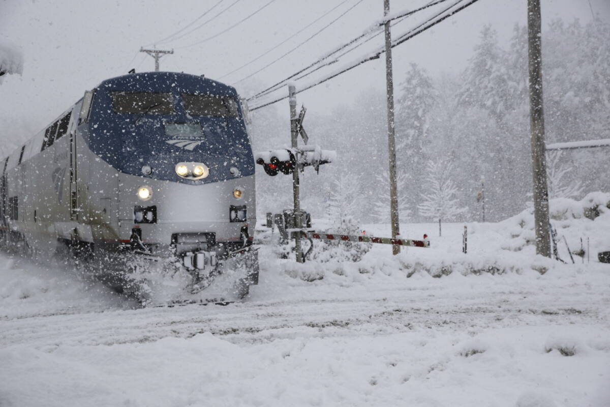 The southbound Amtrak Vermonter arrives at the station in Waterbury, Vt., during a snowstorm on Tuesday, March 14, 2023. The train was traveling during a winter storm 