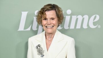 Judy Blume in a white pantsuit on a 2023 red carpet