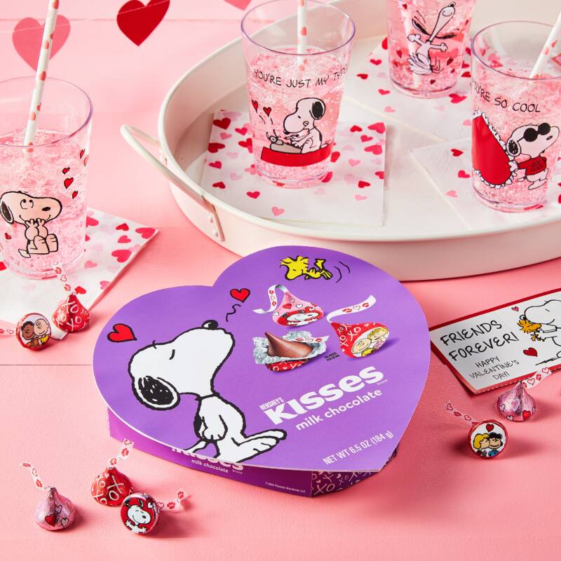 New Hershey Kisses with Snoopy wrapping in heart-shaped box.