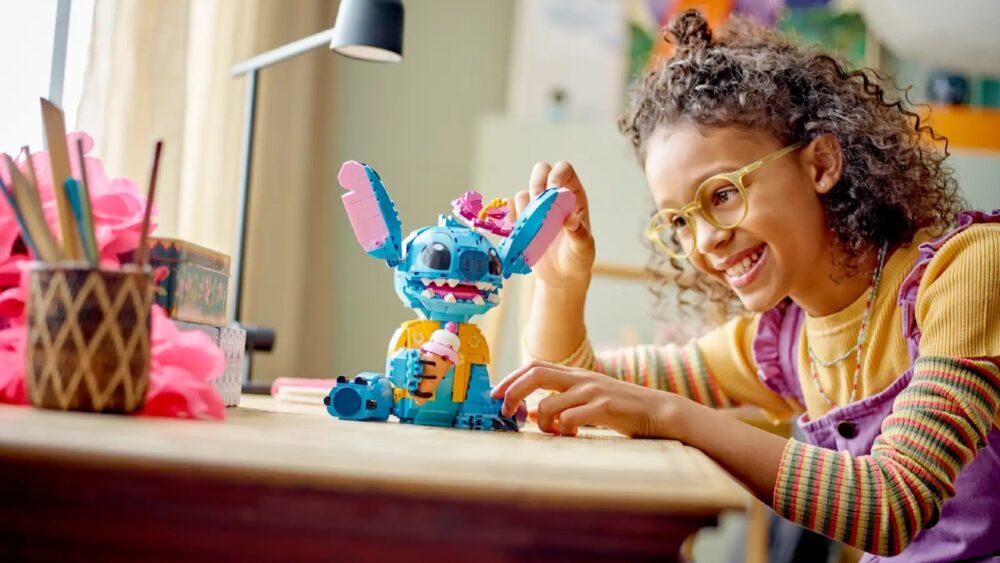 girl playing with stitch lego