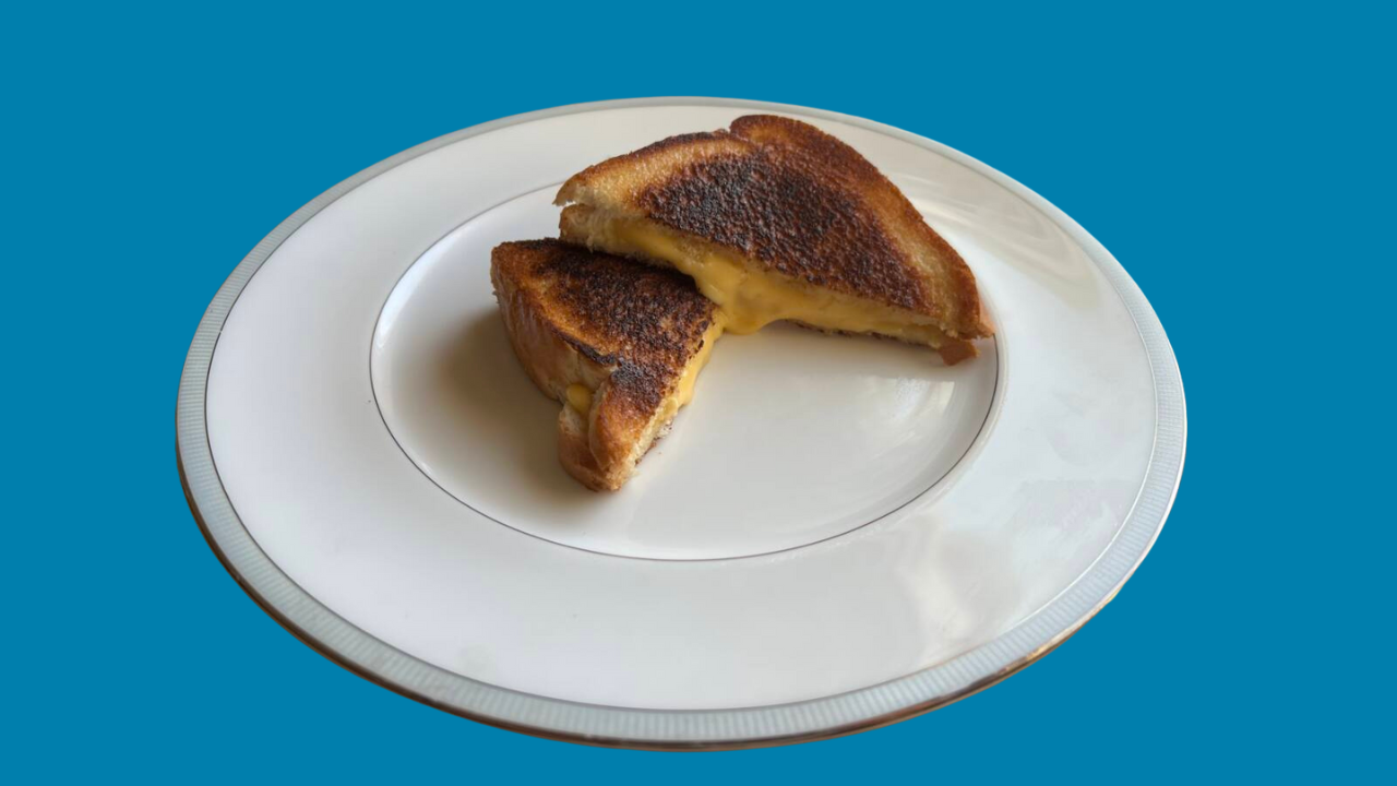 Grilled cheese cooked with mayonnaise on a plate