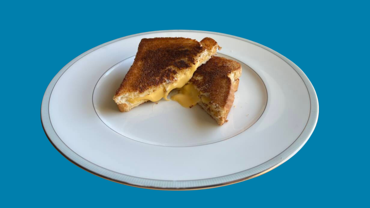 Grilled cheese sandwich cooked with buttered bread