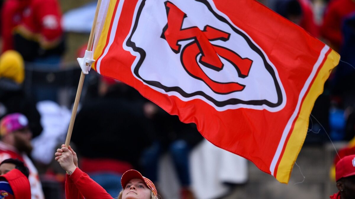 A fan waves a Chiefs' flag