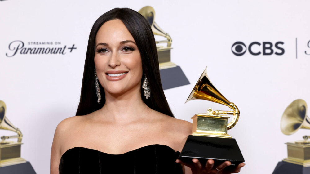 Kacey Musgraves poses with her Grammy in 2024