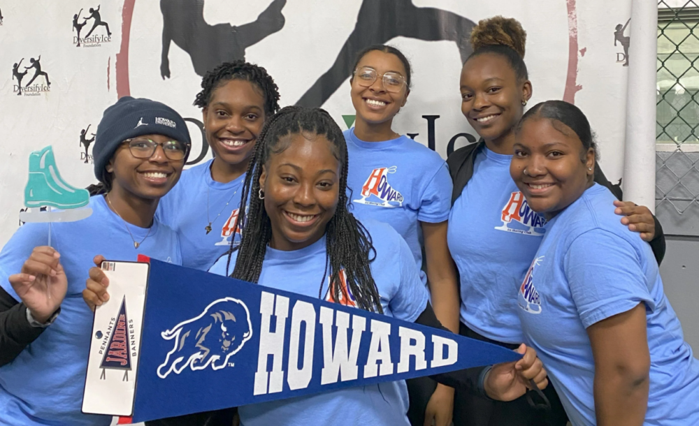 Howard University Figure Skating team members hold school banner