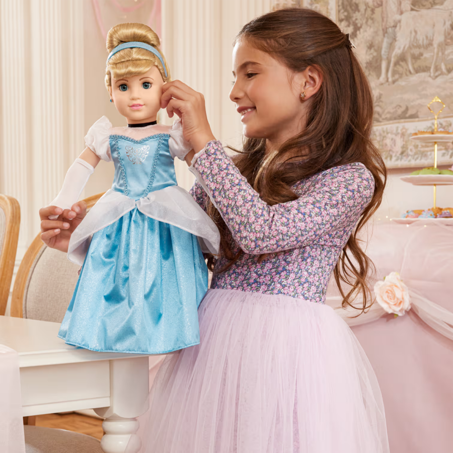 Little girl posing with American Girl Disney Princess Cinderella doll