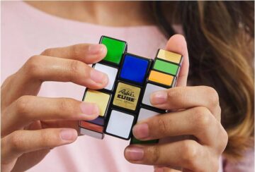 girl playing with Rubik's Cube