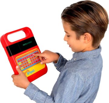 kid playing with Speak and Spell