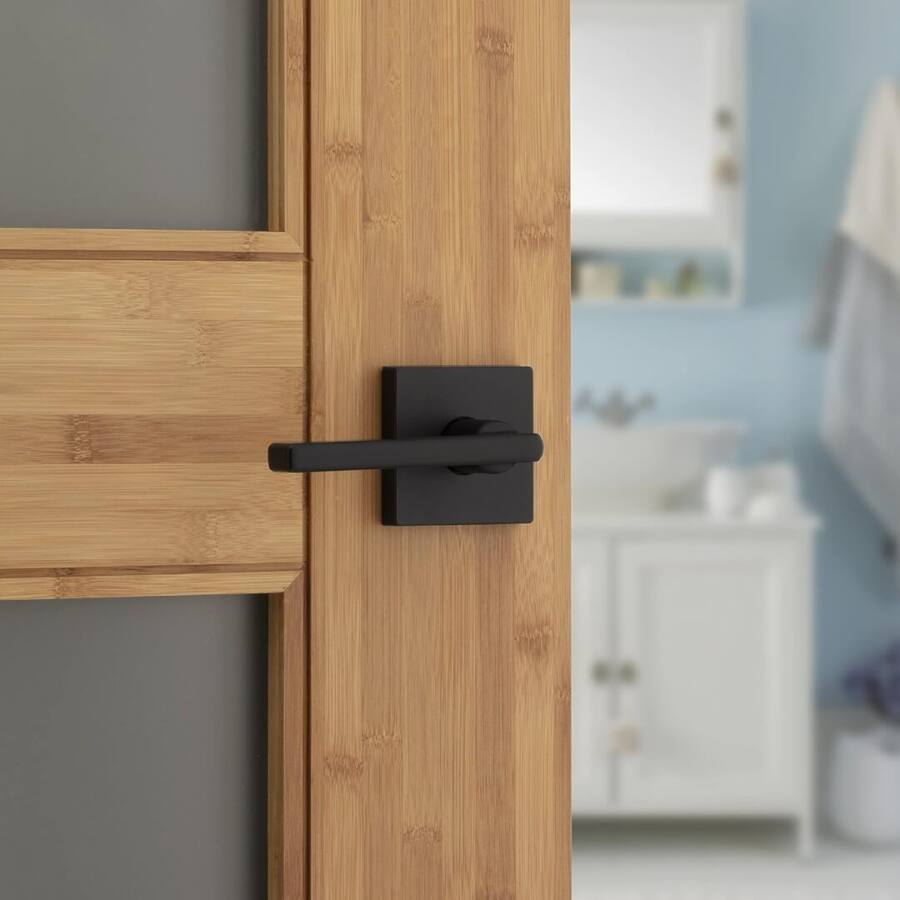 image of wooden door with lever-style door handle