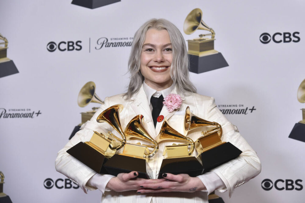 Phoebe Bridgers poses with Grammy Awards