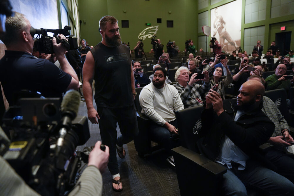 Jason Kelce walks into his retirement press conference.