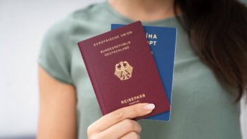 Woman Holding Two Passports.