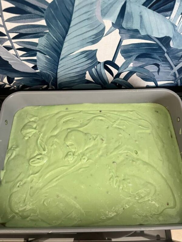 This green pistachio cake for St. Patrick's Day lifted so easily from the Caraway baking pan when it was done.