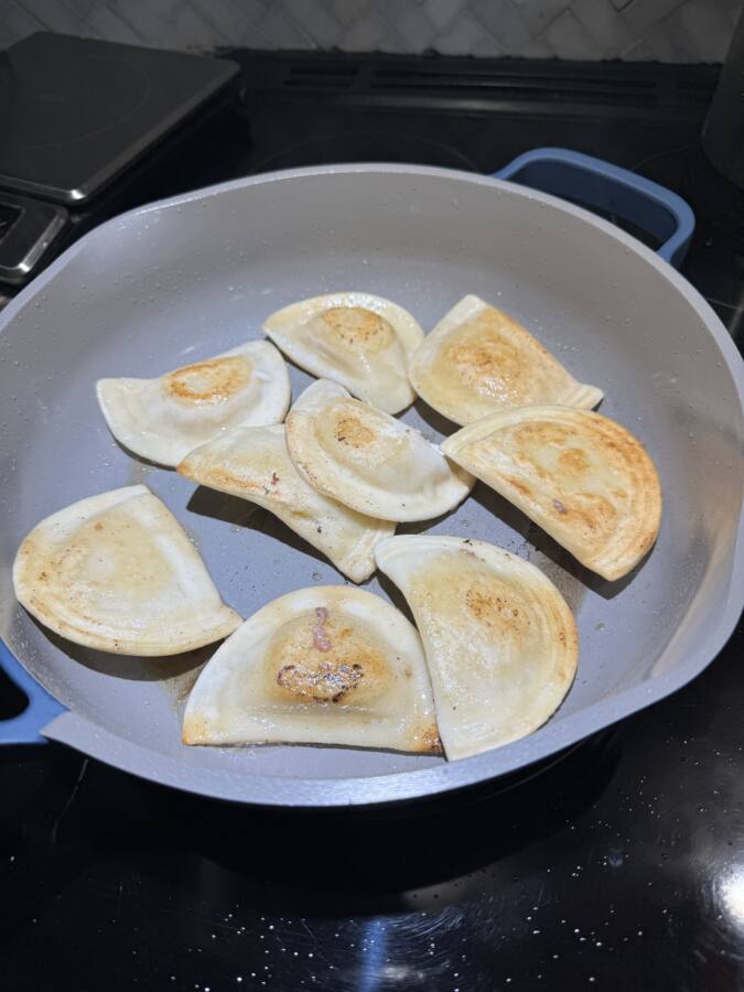 Pierogi frying in Always 2.0 pan