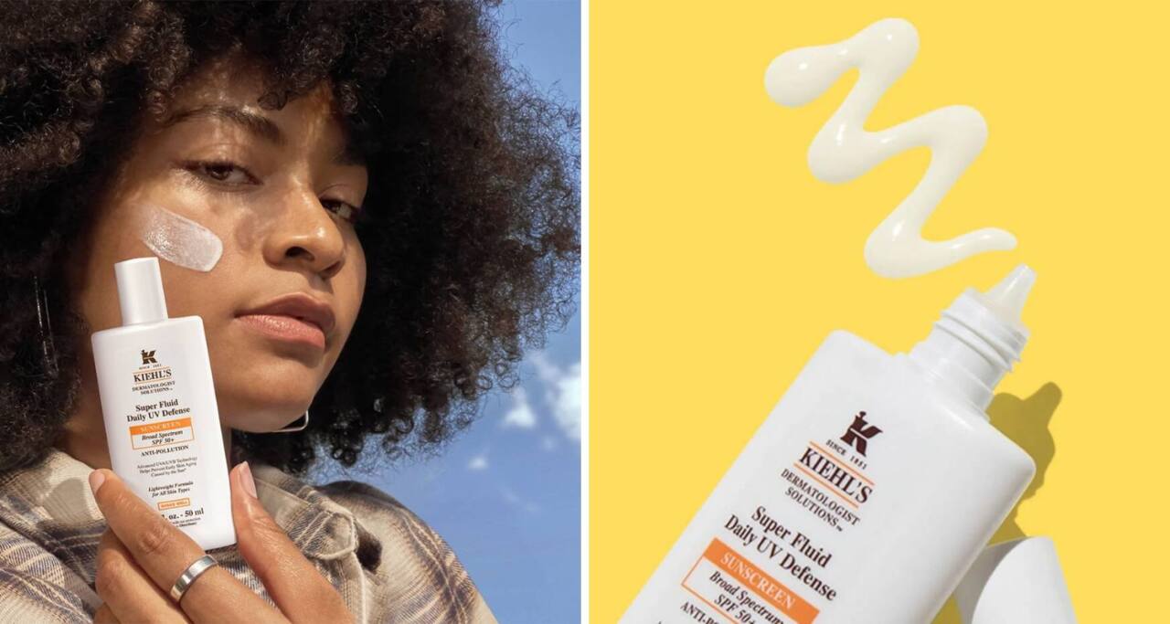 Woman with a swipe of sunscreen lotion on cheek; Kieh’s Super Fluid Sunscreen