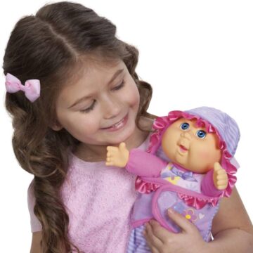Little girl holding Cabbage Patch Kid