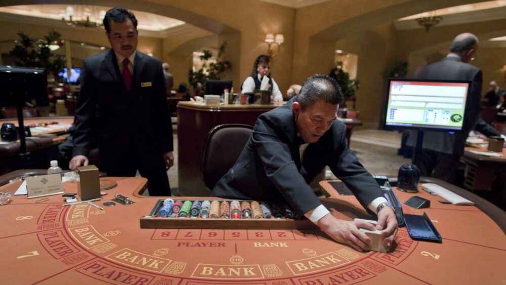 Dealer shuffles cards at hotel in Vegas