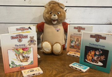 Vintage Teddy Ruxpin doll with books and cassettes