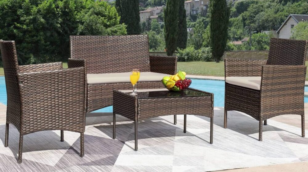 outdoor furniture sets - image of 4-piece outdoor set against a pool and trees