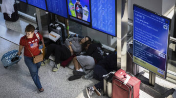 Delayed passengers sleep in airport terminal