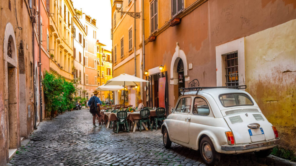 Street scene in Rome with cafe and car