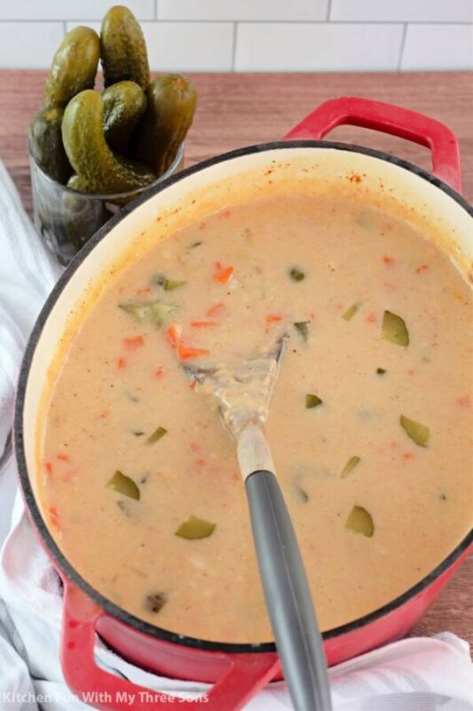 Dill pickle soup in red pot