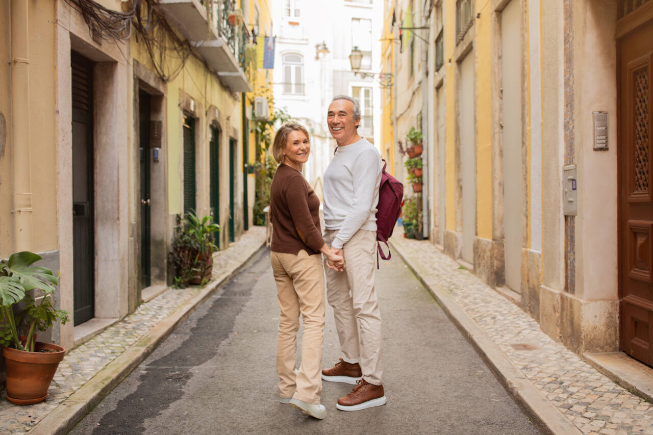 older couple walking in European city